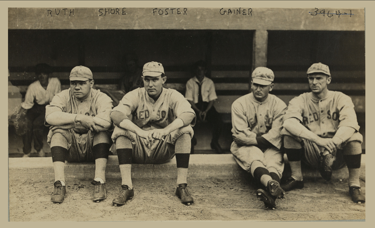 Red Sox players Ruth, Shore, Foster and Gainer seated in dugout — historic image