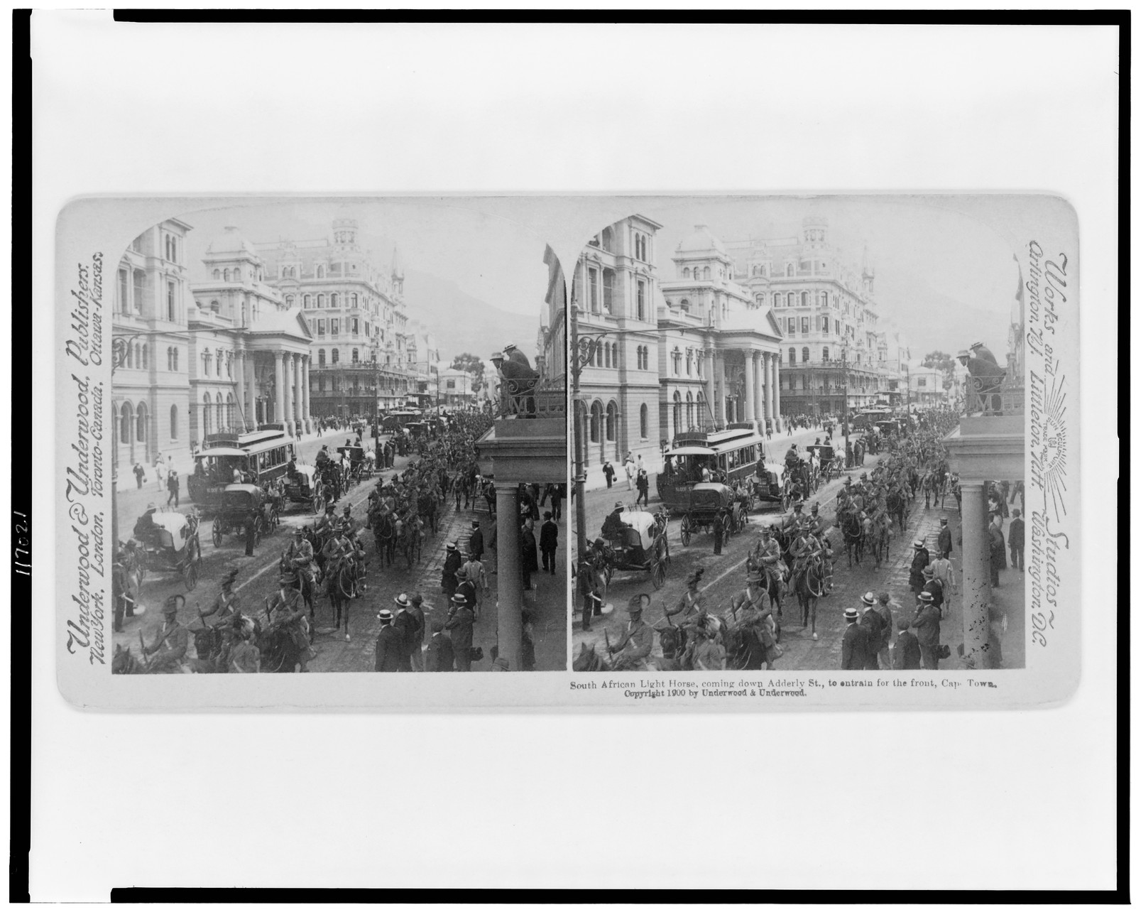 South African Light Horse, coming down Adderly St., to entrain for the front, Cape Town, New York : Underwood & Underwood, c1900. — historic photograph