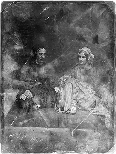 [Unidentified man, about 40 years of age and a somewhat younger woman, both in Oriental costume, full-length portraits, both seated on a carpet on the floor, the man, on the left, cross-legged, turned three-quarters to the right, holding a string of beads; the woman turned slightly to the left, wearing a beaded (?) cap; between them is a hookah, the stem of which both are holding]