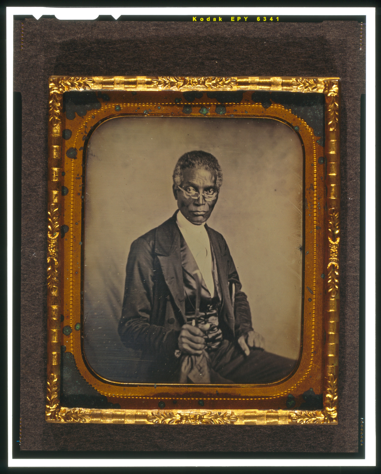[Philip Coker, three-quarter length portrait, full face, seated, wearing spectacles], [between 1856 and 1860] — historic photograph