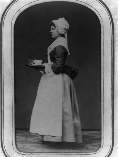 [Maid carrying a tray]