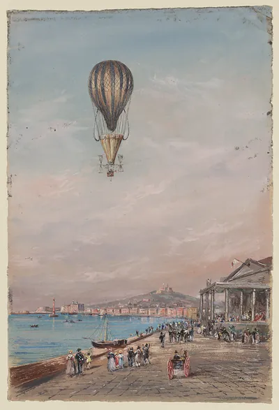 Hot air balloon over a bay with a seafront promenade