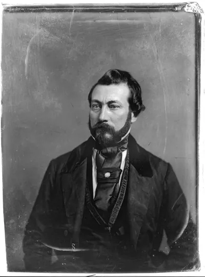 Bearded man in dark coat and cravat, 19th-century portrait