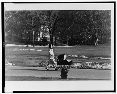 Fresh air on the White House grounds for John F. Kennedy, Jr., in March 1961 / Capa.