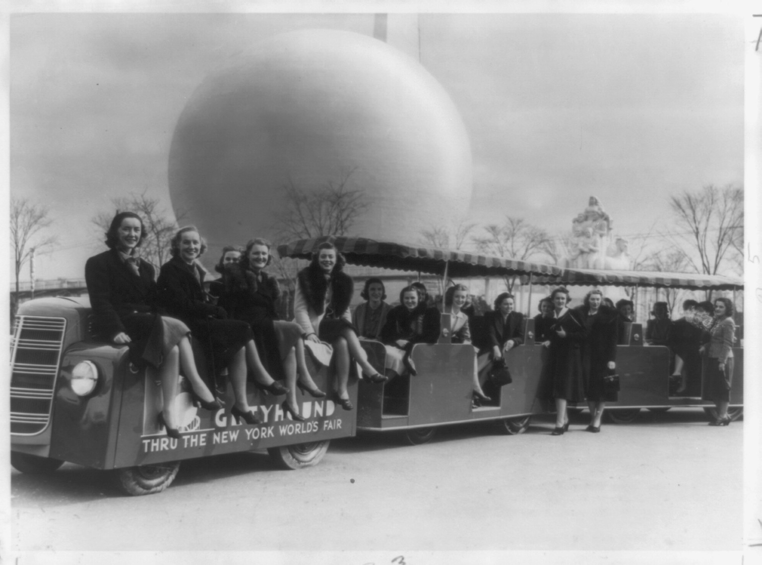 Fair tractor train behind fair" foreground", 1939 — historic photograph