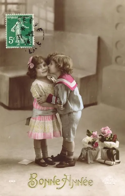 Children kissing on hand-colored 'Bonne Année' New Year postcard
