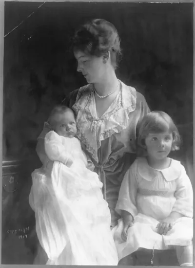 [Mrs. Theodore Roosevelt, three-quarter length portrait, seated, facing left, with two small children]