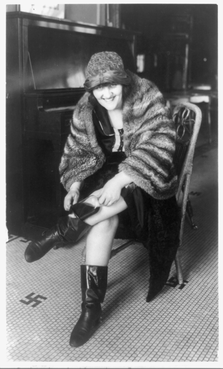 [Woman putting flask in her Russian boot, Washington, D.C.], 1922 Jan. 21. — historic photograph
