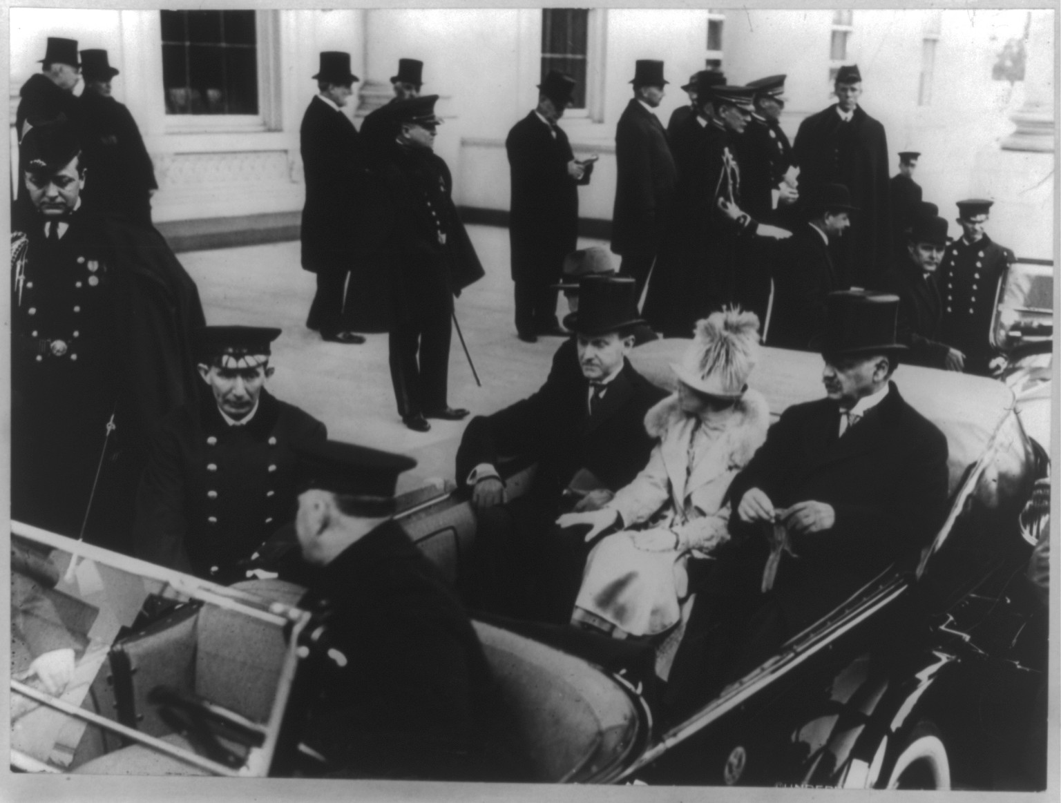 Coolidges leave White House for Capitol. President and Mrs. Coolidge, accompanied by Senator Charles Curtis [in auto on way to Coolidge's inauguration], 1925 Mar. 4. — historic photograph