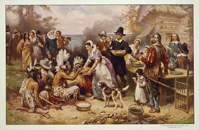 Pilgrims and Native Americans sharing a First Thanksgiving meal