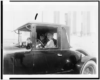 [Man and woman, in automobile, in the Washington, D.C., area]
