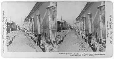 Cuban laborers laying pipes in the streets of Santiago, Cuba
