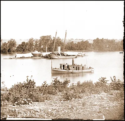 James River Va. U.S.S. monitor Canonicus taking on coal from a schooner
