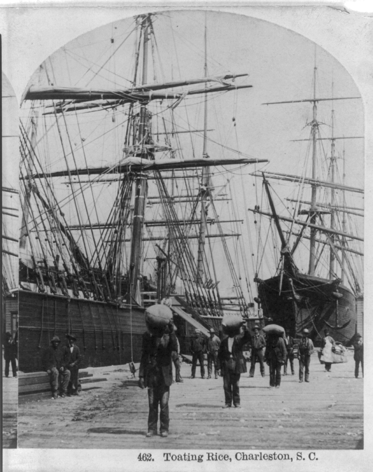 [African Americans working, Charleston, S.C.: Toating rice on dock], c1879. — historic photograph