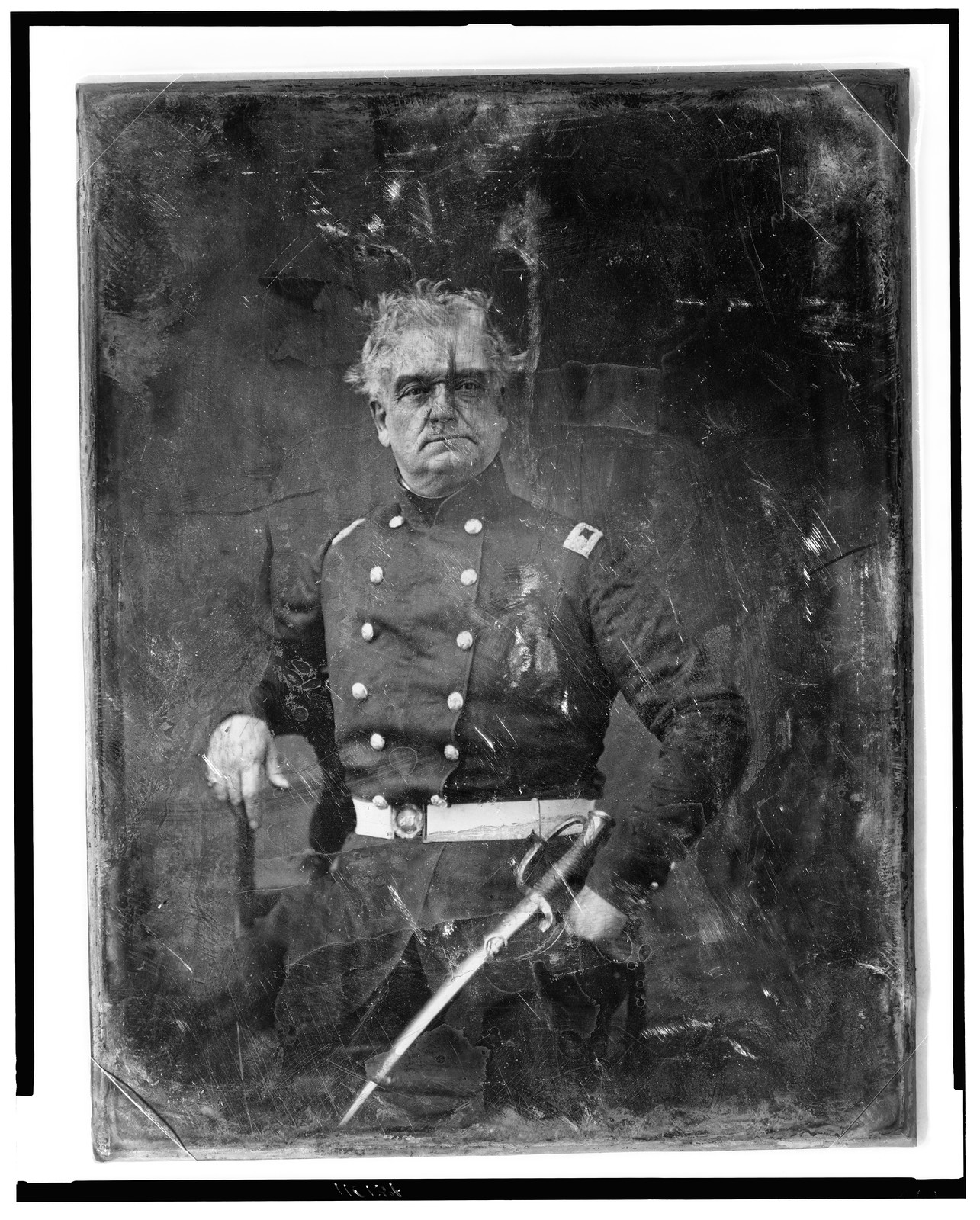 [Unidentified military officer, three-quarter length portrait, facing front, standing, in uniform, with sword], [between 1844 and 1860] — historic photograph