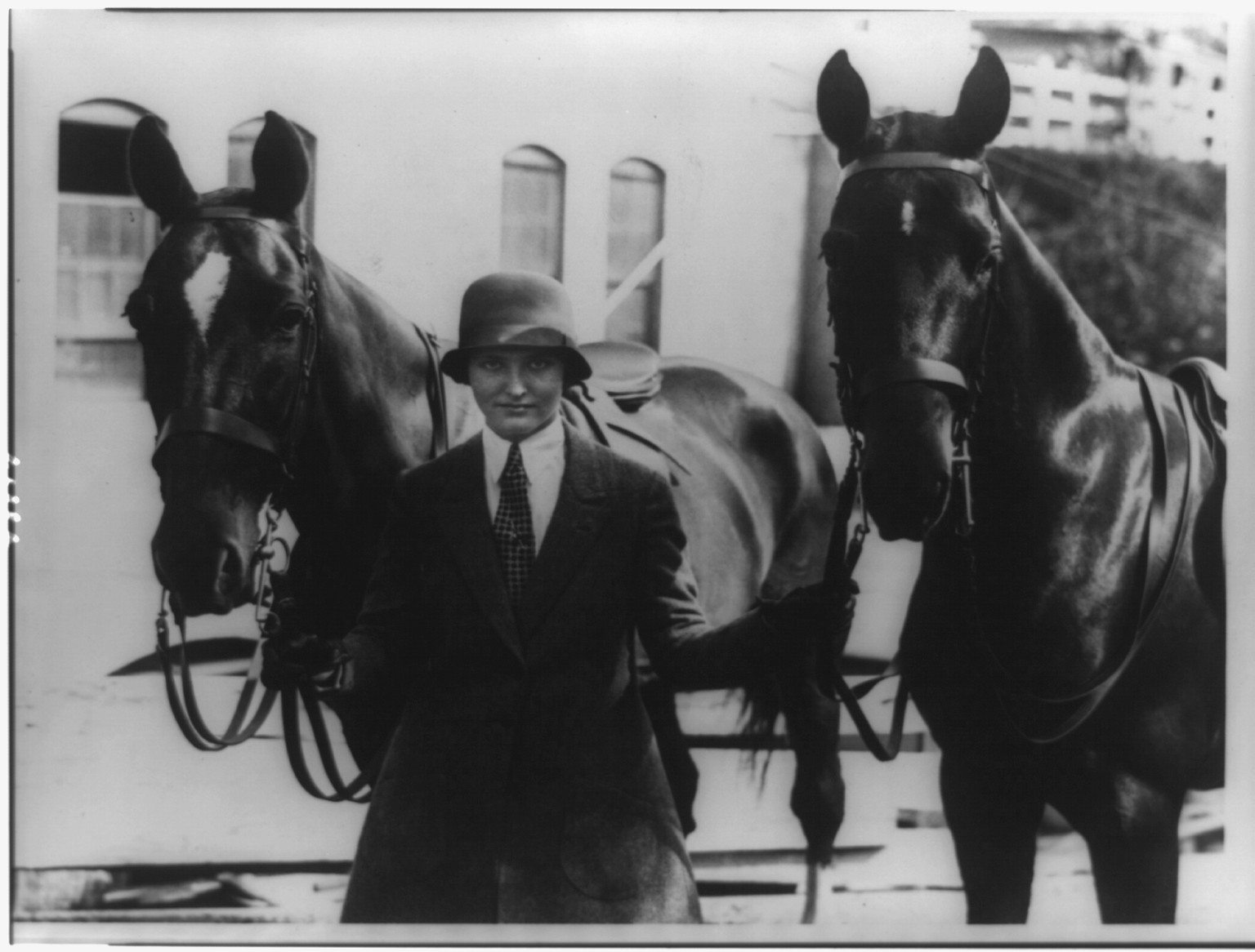 Annual Washington horse show opens at the riding and hunt club- Mary Parker Corning, daughter of Parker Corning, congressman from New York, with her two entries Joy" and "Red"", [between 1909 and 1932] — historic photograph
