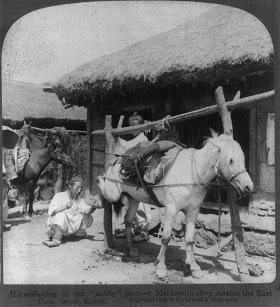 Horseshoeing on the safety" plan - a blacksmith shop outside the East Gate Korea"