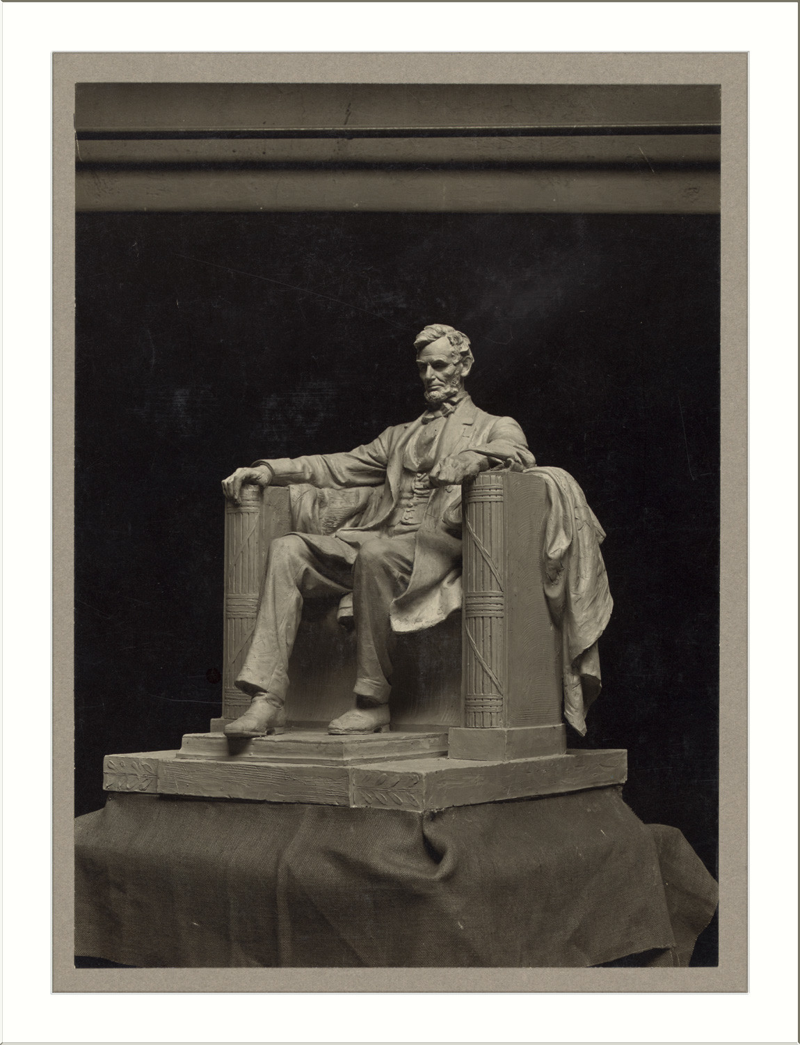 Seated Lincoln statue model on pedestal, photographed — historic photograph