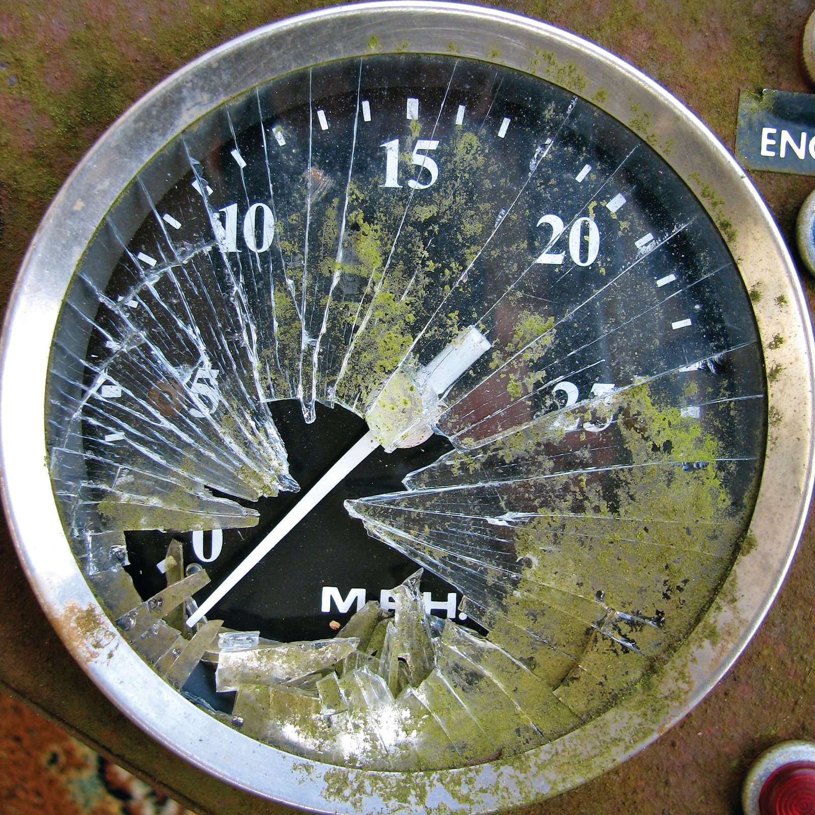 Cracked speedometer with MPH scale and mossy glass — historic image