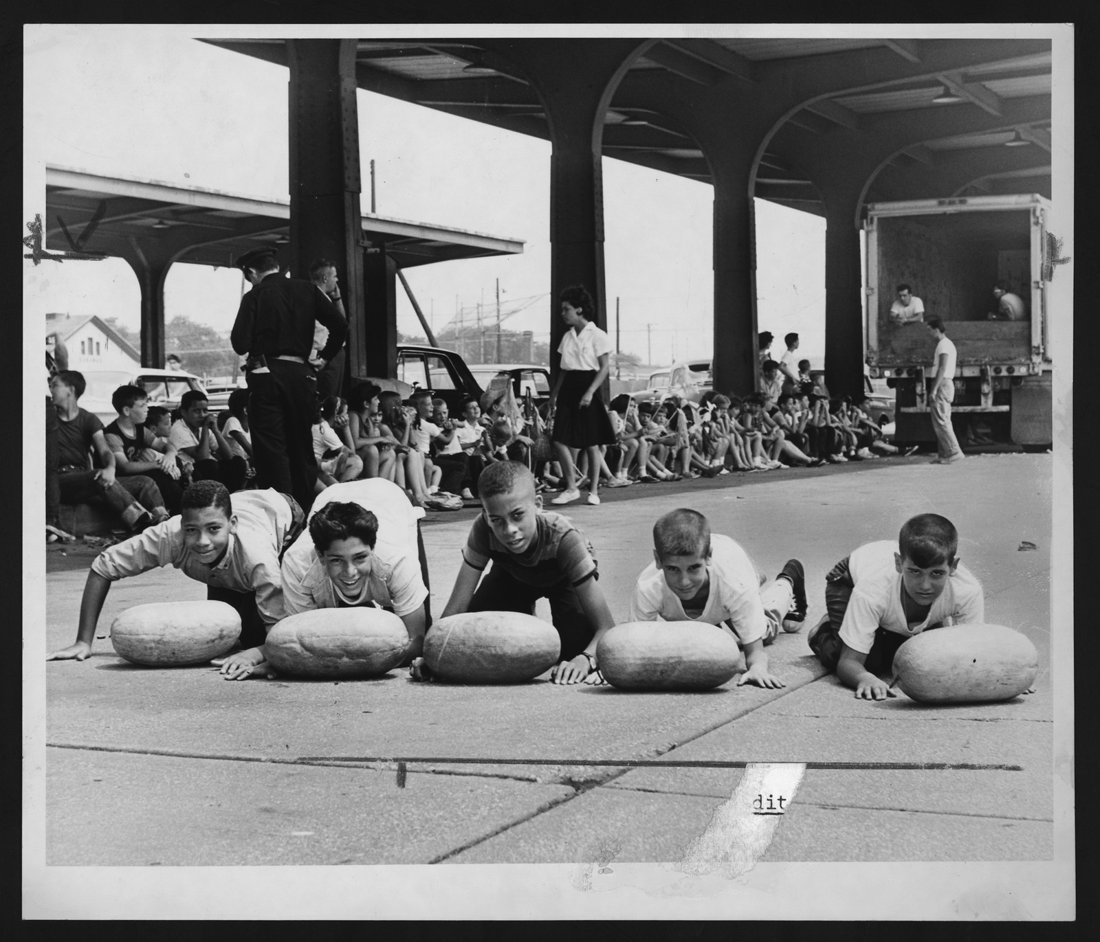 Boys preparing for a watermelon race — historic image