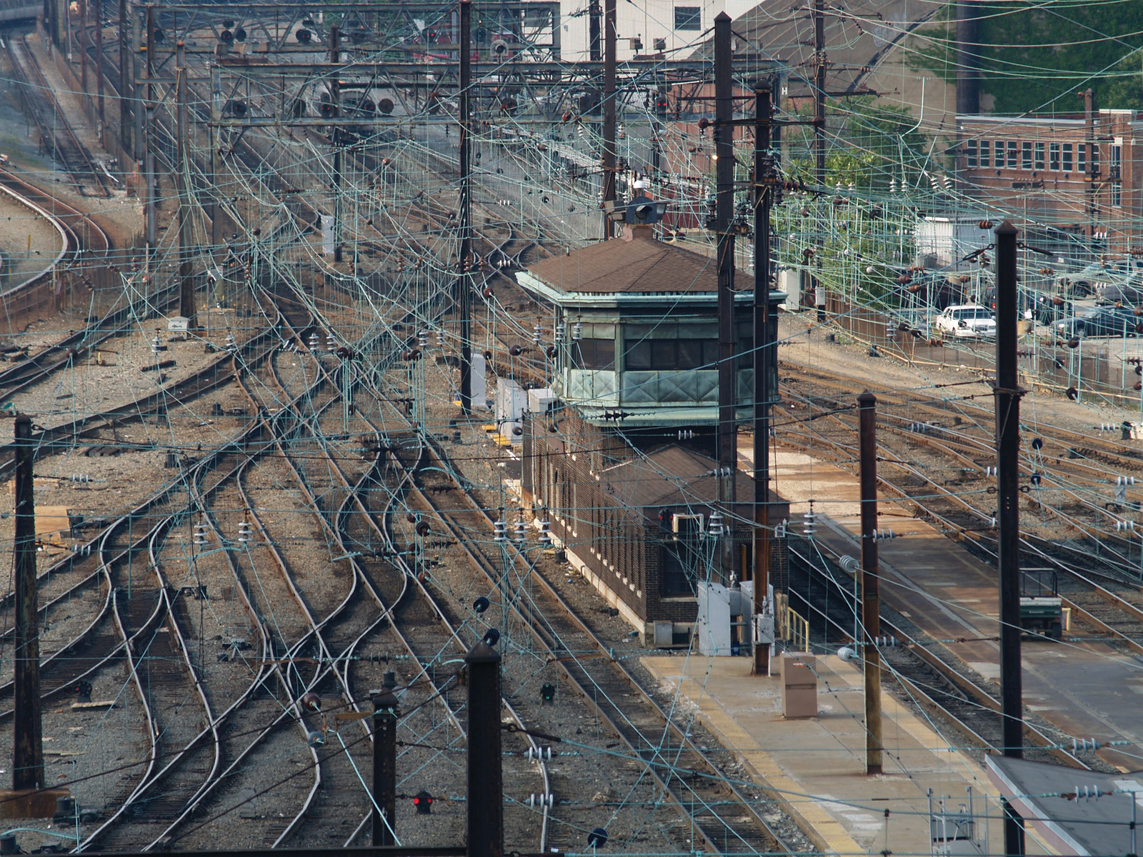 Railway tracks, interlocking tower and overhead catenary wires — historic image