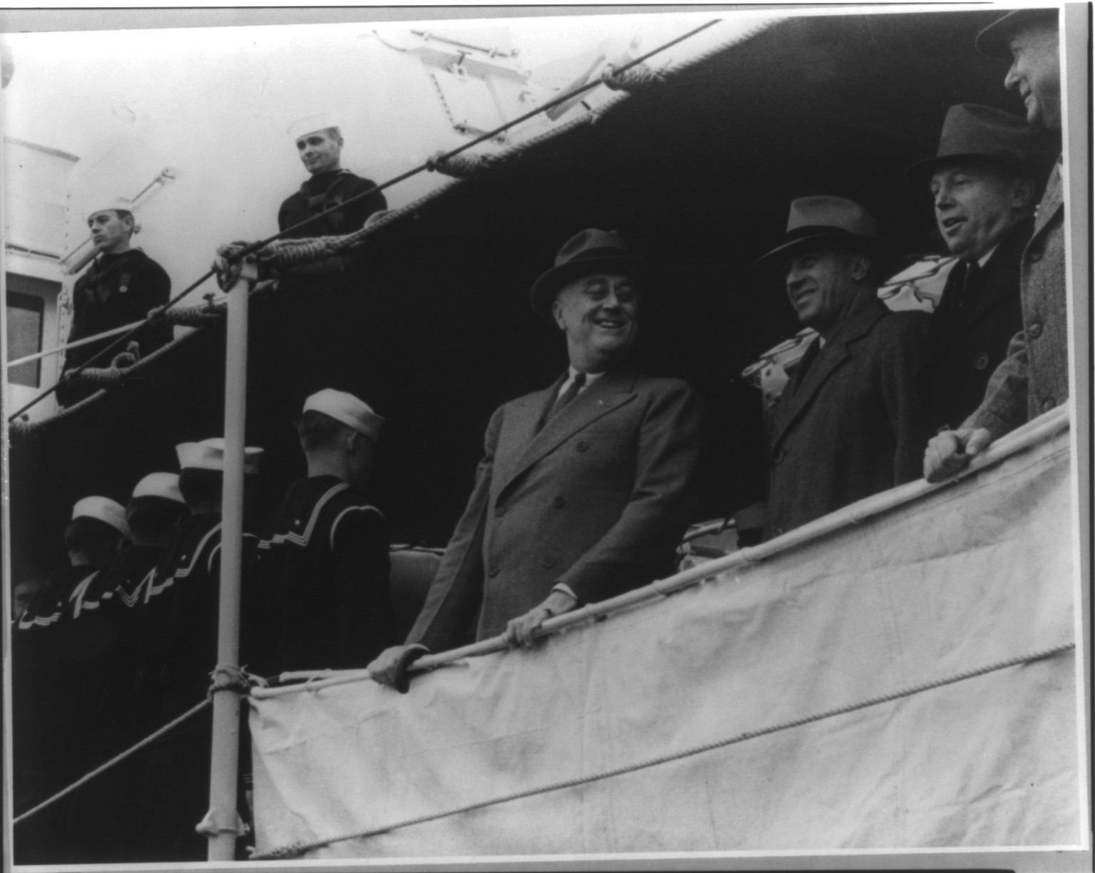[Franklin Delano Roosevelt, half, standing on quartderdeck of USN ship, facing slightly right] — historic photograph
