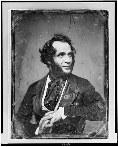 Portrait of a bearded man in a dark jacket