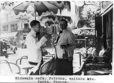 Sidewalk cafe. Patrons, waiters, etc. Paris, France