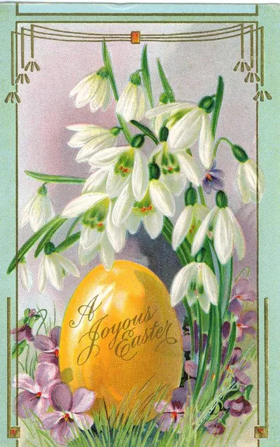 Easter greeting card with golden egg, snowdrops and violets