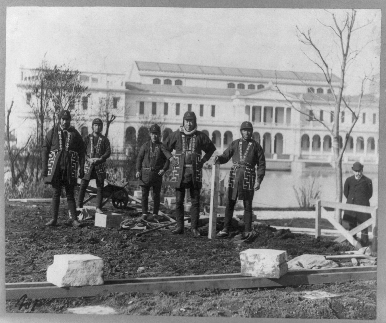 [Japanese carpenters and stone masons in distinctive native attire starting to construct Japanese Pavilion at World Columbian Exposition, Chicago, 1893: posed on site of construction], c1892 Dec. 5. — historic photograph