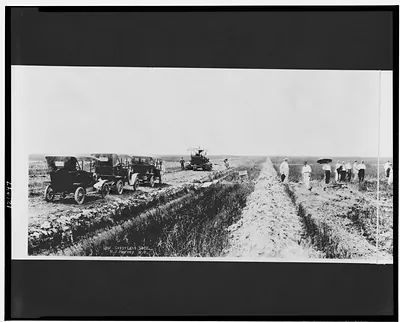 [Gasoline plow & gasoline road machine working on reclaimed prairie]