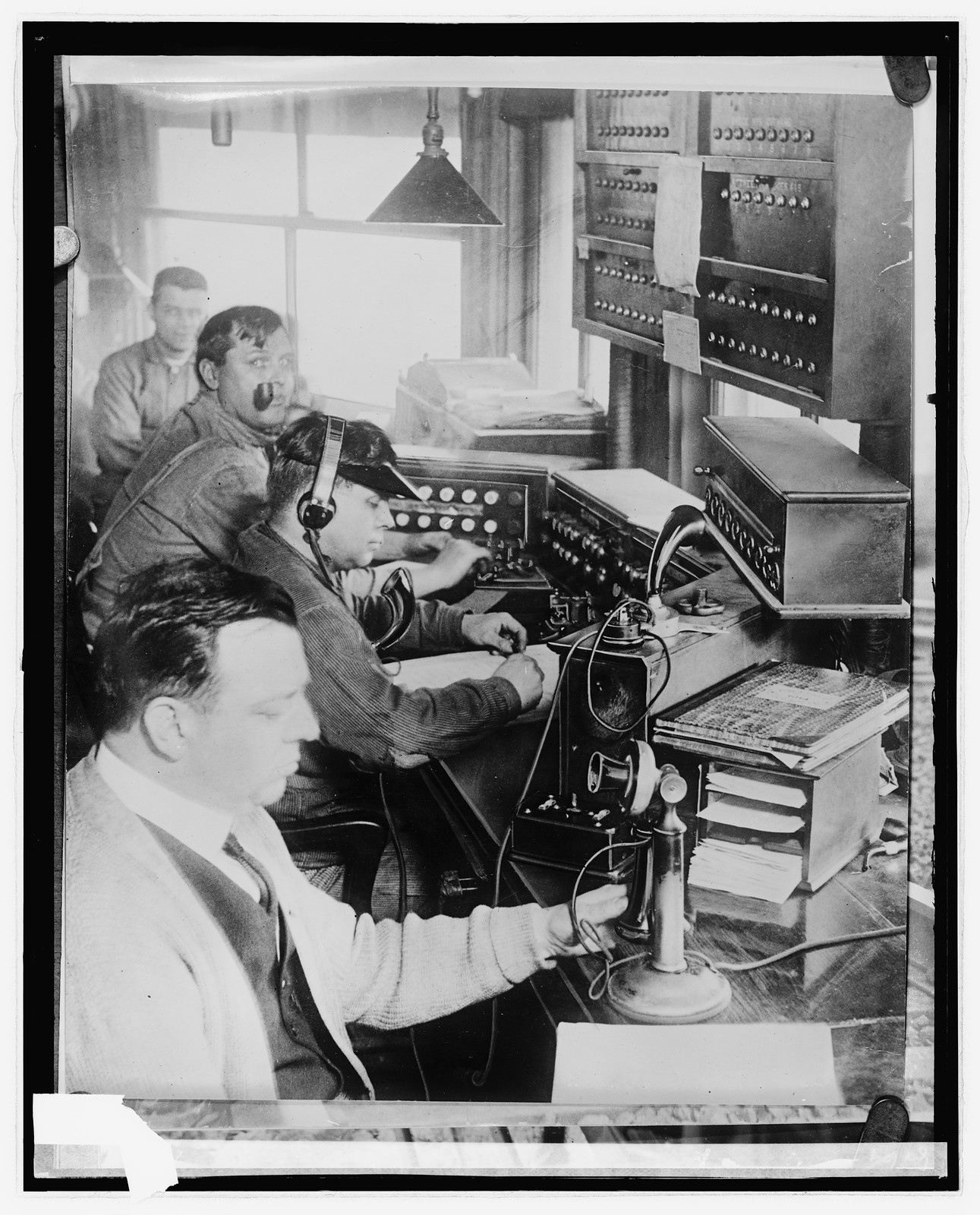 [Telephone/radio operators?], [between 1921 and 1922] — historic photograph