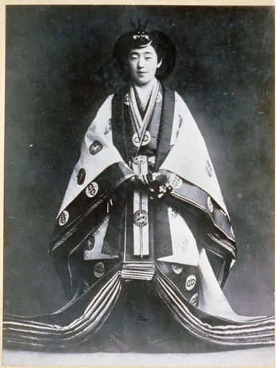 The Empress is crowned in traditional ancestral robes--she is the first to share throne equally with Emperor