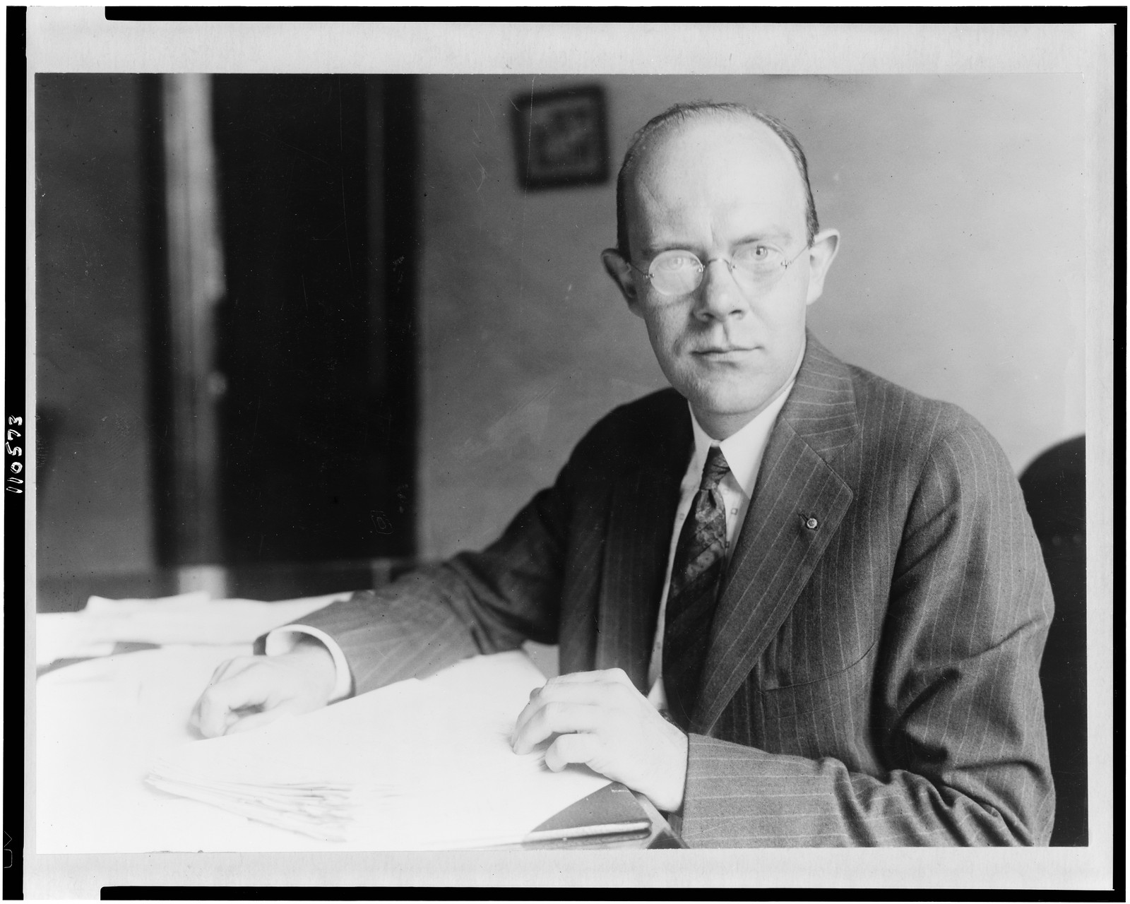 [Thomas Miller, half-length portrait, seated at desk, facing front], [between 1920 and 1950] — historic photograph