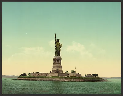 Statue of Liberty on its island, color print