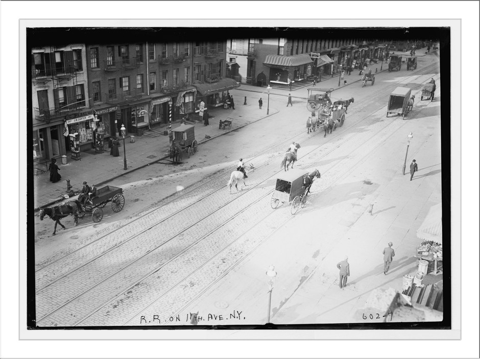 Train tracks and horse-drawn carts on 11th Ave. , New York City, n/a — historic photograph