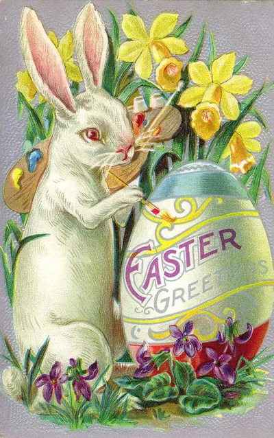 White rabbit painting an egg, Easter Greetings card