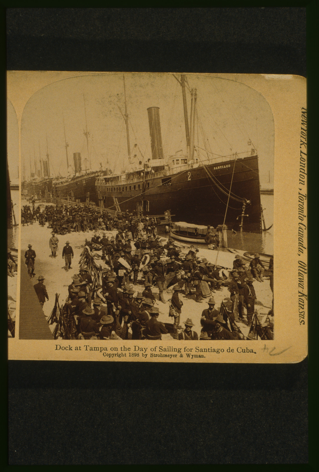 Dock at Tampa on the day of sailing for Santiago de Cuba, New York, N.Y. : Strohmeyer & Wyman, publishers, c1898. — historic photograph