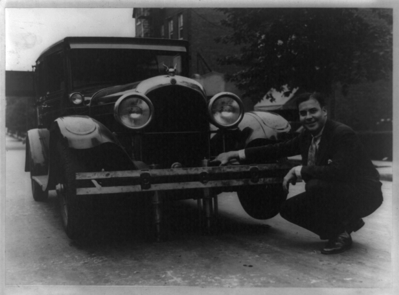 Haka auto jacks. Two years to perfect jack controlled by lever on dash board, raising any or all four wheels, [no date recorded on caption card] — historic photograph
