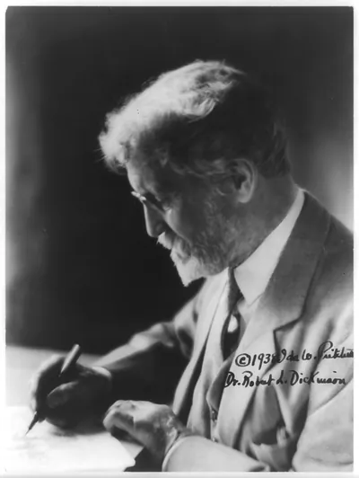[Robert Latou Dickinson, 1861-1950, head-and-shoulders portrait, left profile, writing at desk]