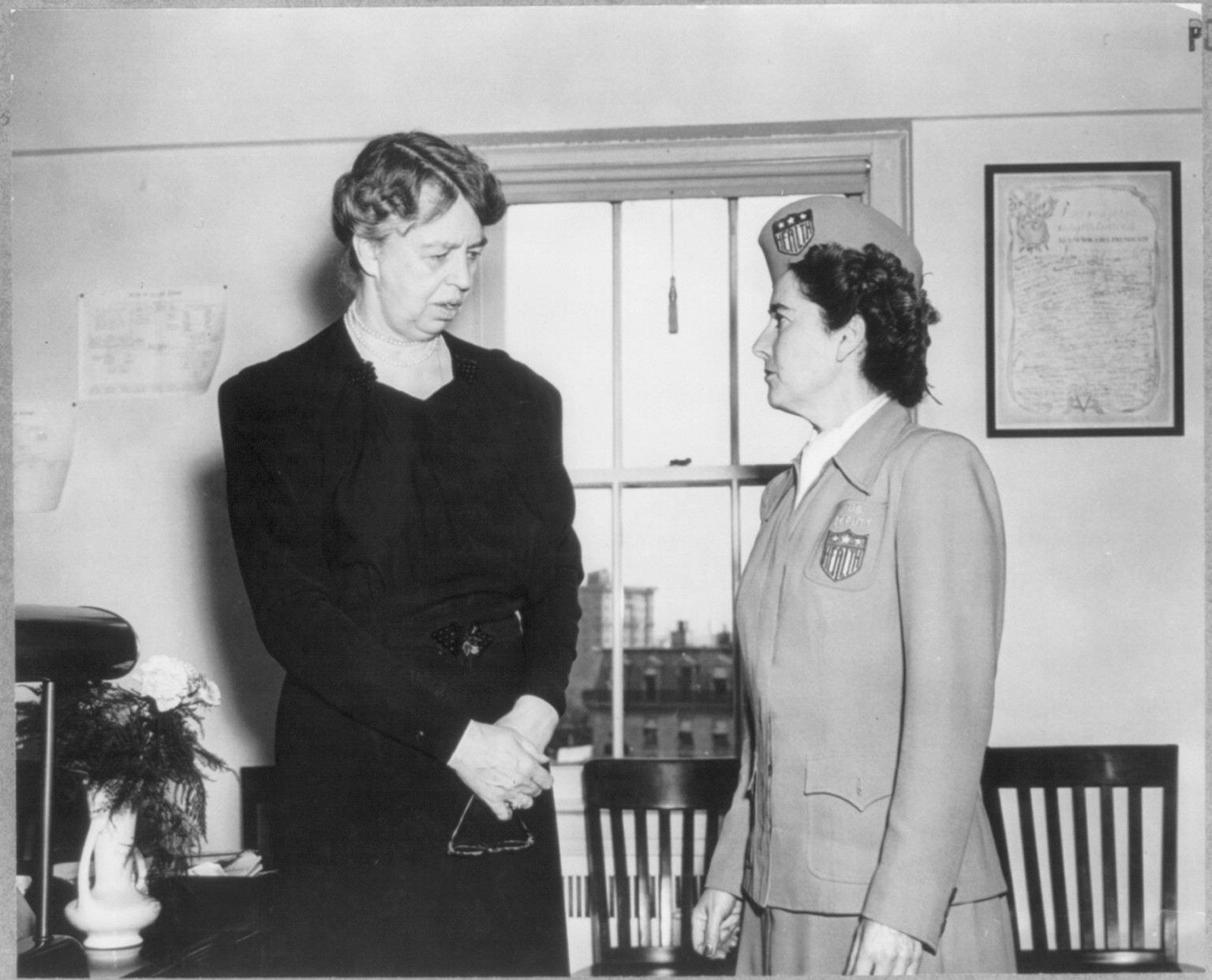 [Eleanor Roosevelt, three-quarters length portrait, standing, facing right. Eleanor Roosevelt, Asst. Dir., Office of Civilian Defense and Mary K. Browne, Deputy Dir. in Charge of Physical Fitness, Office of Civilian Defense] — historic photograph