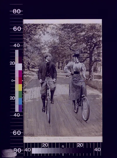 Man and woman cycling on a tree-lined road