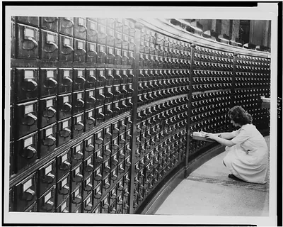 [Woman at Main Reading Room card catalog in the Library of Congress]