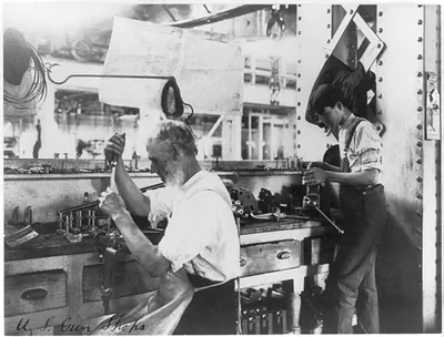 [U.S. Naval Gun Factory. Wash. D.C. 2 men working at bench]