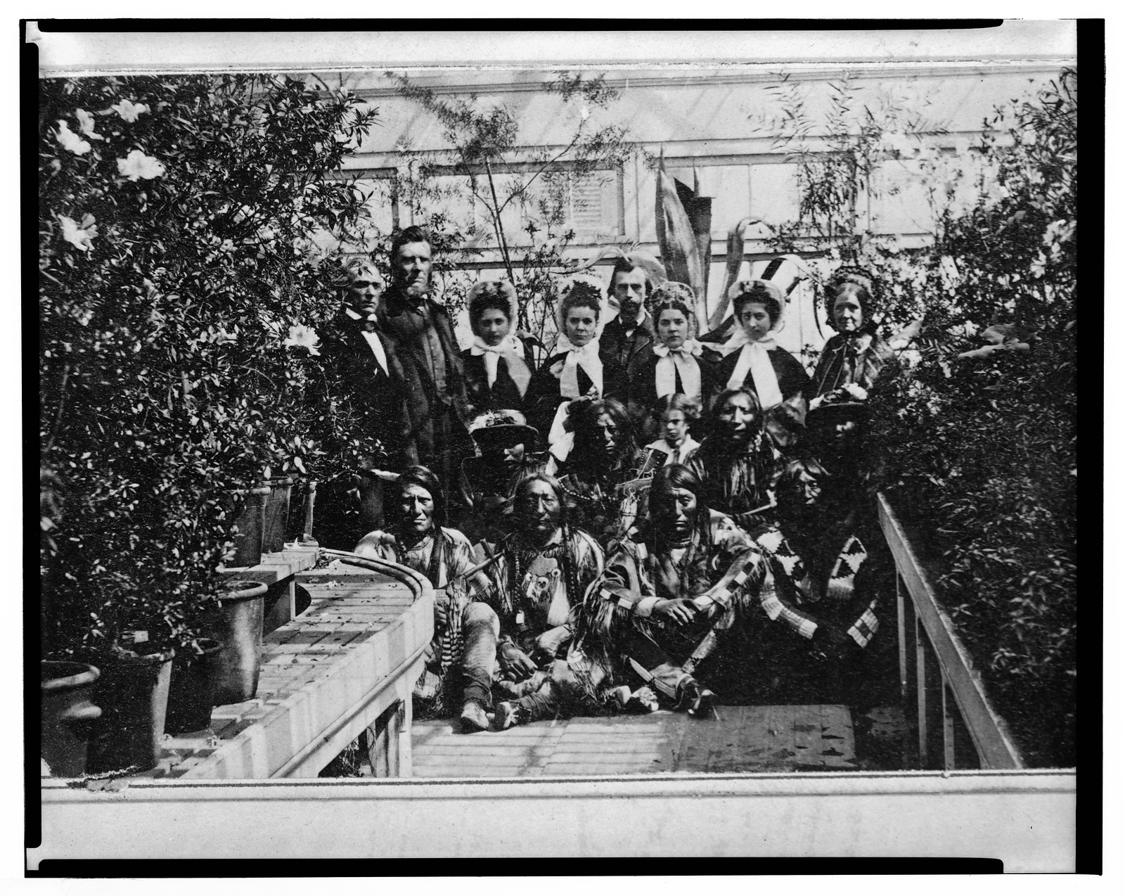 [Indian delegation in the White House Conservatory during the Civil War, with J.G. Nicolay, President Abraham Lincoln's secretary, standing in center back row ] / Brady, New York., [1863 March 27] — historic photograph
