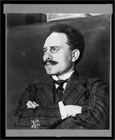 [Dr. Karl Liebknecht, head-and-shoulders portrait, arms crossed, facing left]