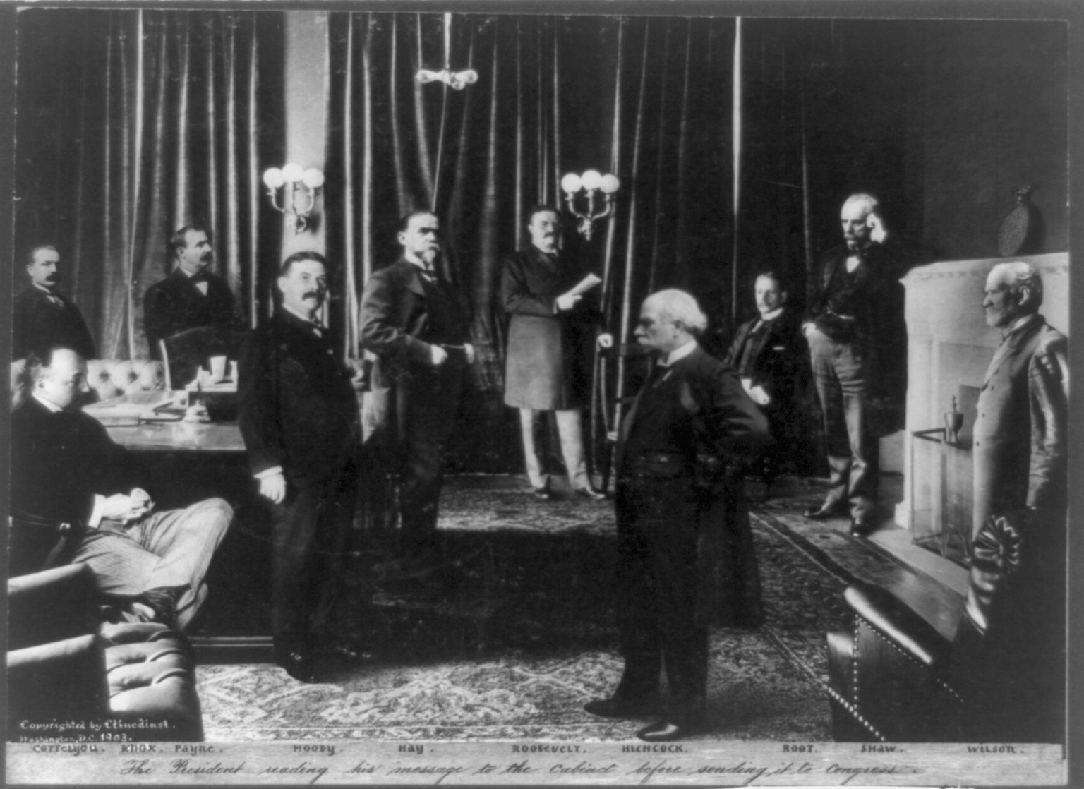 Roosevelt Cabinet group the president reading his message to the Cabinet before sending it to Congress., c1903. — historic photograph
