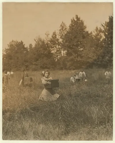 Tersea ------ carrying peck of cranberries (weighing about 15 pounds) long distance to "bushel man." Did not know age. Forsythe's Bog, Turkeytown, near Pemberton, N.J. Sept. 29, 1910 Witness E. F. Brown,. Location: Pemberton, New Jersey / Photo by Lewis W. Hine.