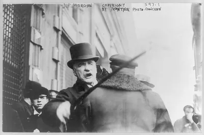 [J.P. Morgan striking photographer with cane]