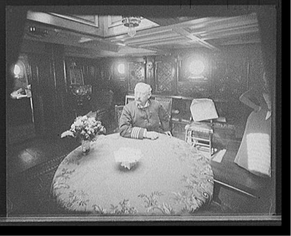 [U.S.S. Raleigh, Capt. Coghlan in his cabin, [1898?] — historic photograph